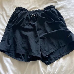 Black Nike running shorts with lining